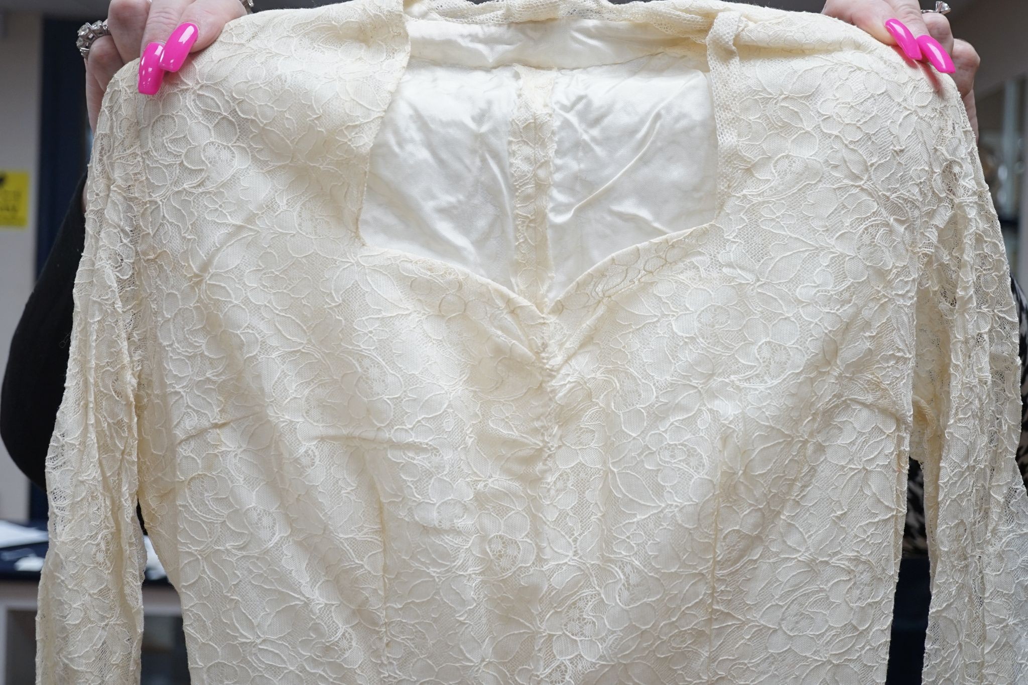 A late 1930's- 40's cream machine lace wedding dress and petticoat together with a pear listed floral tiara/ headdress.
